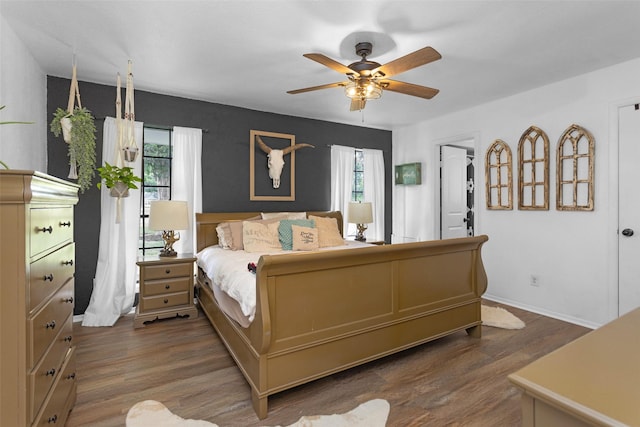 1137 Jones Rd, New Waverly, TX 77358 - bedroom with wood finished floors, baseboards, and ceiling fan