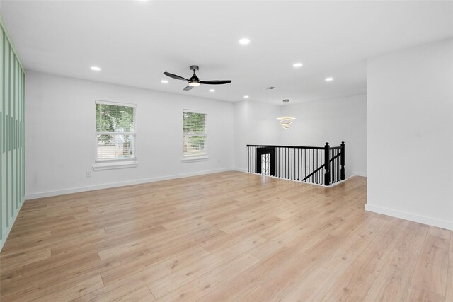 8707 Wind Side Dr, Houston, TX 77040 - spare room with recessed lighting, light wood finished floors, ceiling fan, and baseboards