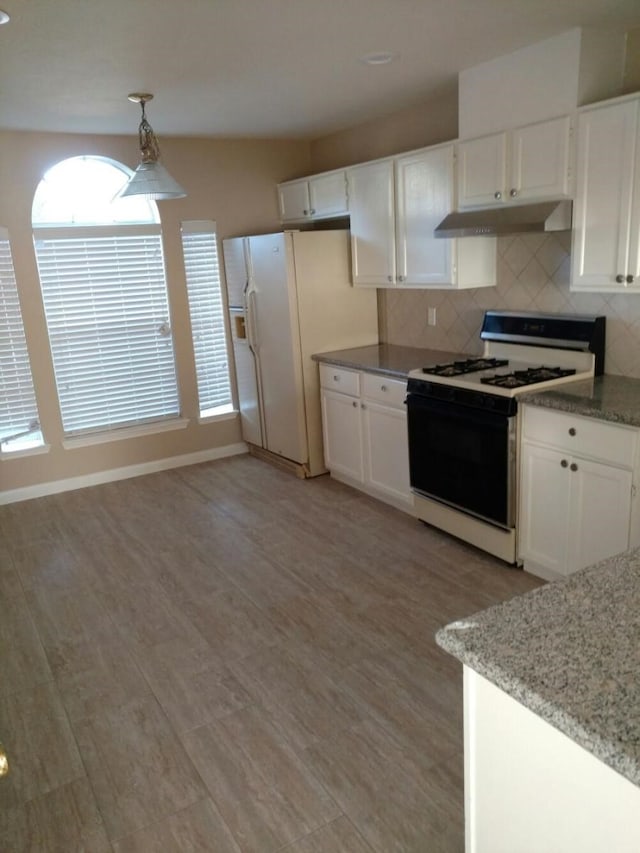 3502 Sheldon Dr, Pearland, TX 77584 - kitchen with white appliances, under cabinet range hood, and white cabinets