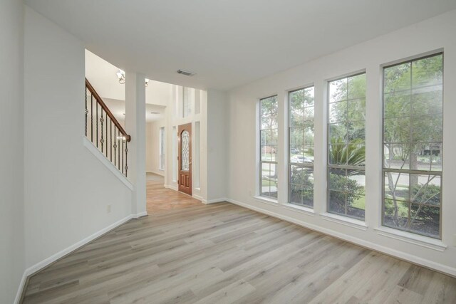26122 Salt Creek Ln, Katy, TX 77494 - unfurnished room with light wood finished floors, stairway, and baseboards