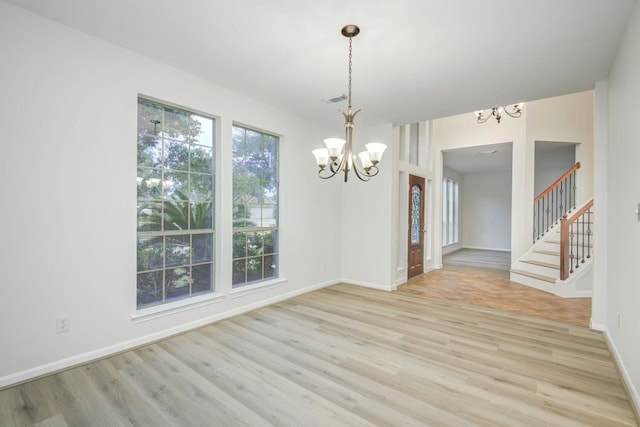 26122 Salt Creek Ln, Katy, TX 77494 - spare room featuring a chandelier, light wood finished floors, baseboards, and stairs