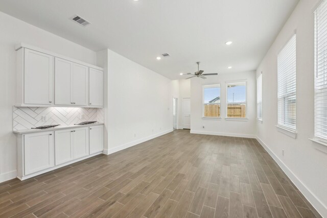 19265 Hazel Firs Ct, Magnolia, TX 77355 - unfurnished living room featuring wood finished floors, ceiling fan, and recessed lighting