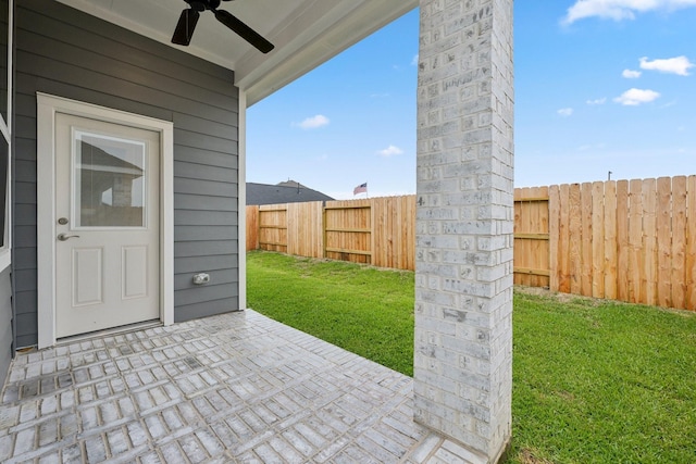 19265 Hazel Firs Ct, Magnolia, TX 77355 - fenced backyard with ceiling fan and a patio area