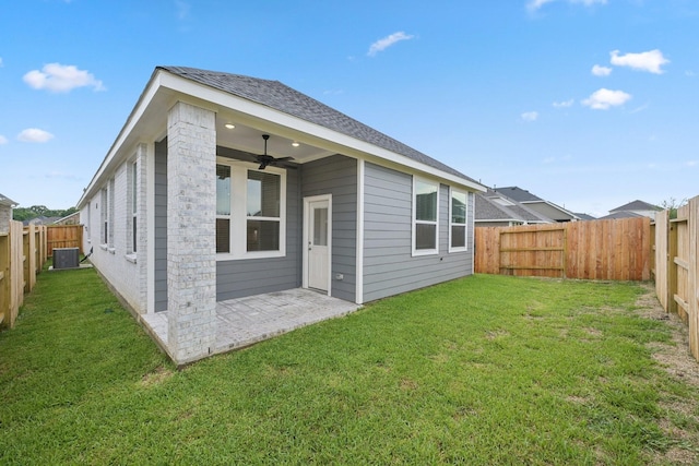19265 Hazel Firs Ct, Magnolia, TX 77355 - back of property with ceiling fan, a fenced backyard, a patio, and roof with shingles