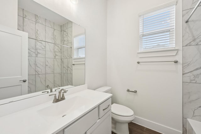 19265 Hazel Firs Ct, Magnolia, TX 77355 - full bathroom with vanity, tiled shower, and wood finished floors