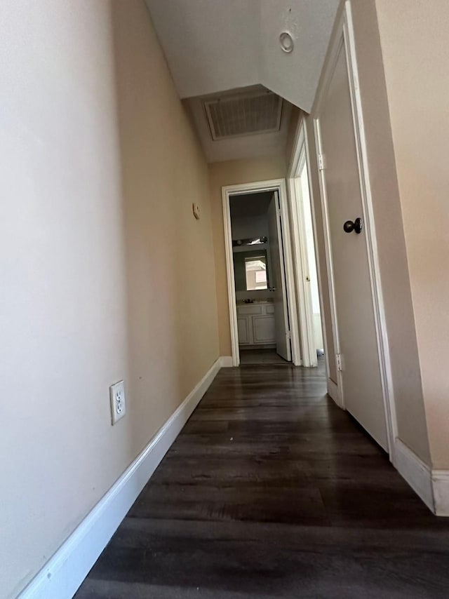 8443 Sands Point Dr, Houston, TX 77036 - corridor featuring wood finished floors, baseboards, and attic access