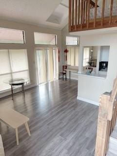 8443 Sands Point Dr, Houston, TX 77036 - living room featuring a towering ceiling and wood finished floors