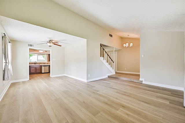 4211 Lucian Ln, Friendswood, TX 77546 - unfurnished living room with a sink, light wood-type flooring, ceiling fan, stairway, and a chandelier