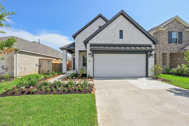 21517 Witham Promenade Ln, Magnolia, TX 77355 - view of front facade featuring driveway, brick siding, and an attached garage