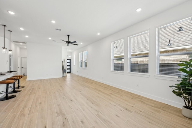 21517 Witham Promenade Ln, Magnolia, TX 77355 - unfurnished living room featuring light wood finished floors, recessed lighting, a ceiling fan, and baseboards