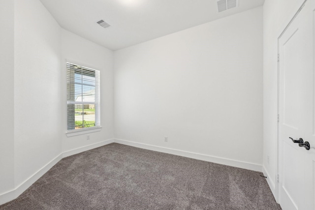 21517 Witham Promenade Ln, Magnolia, TX 77355 - empty room featuring dark carpet and baseboards