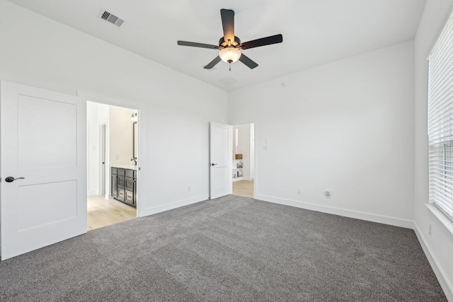 21517 Witham Promenade Ln, Magnolia, TX 77355 - unfurnished bedroom featuring light carpet, baseboards, and ceiling fan