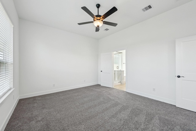 21517 Witham Promenade Ln, Magnolia, TX 77355 - unfurnished bedroom with carpet, baseboards, connected bathroom, and ceiling fan