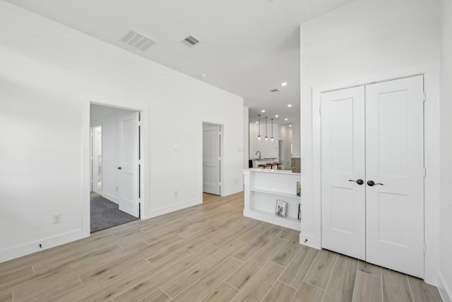 21517 Witham Promenade Ln, Magnolia, TX 77355 - spare room featuring light wood finished floors, baseboards, and recessed lighting