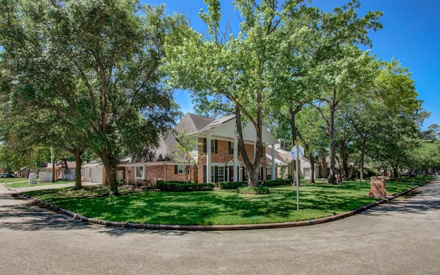 12103 Moorcreek Dr, Houston, TX 77070 - neoclassical / greek revival house with a front yard and brick siding