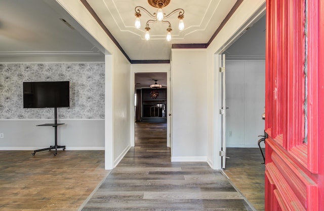 12103 Moorcreek Dr, Houston, TX 77070 - entryway featuring wood finished floors, a chandelier, and ornamental molding