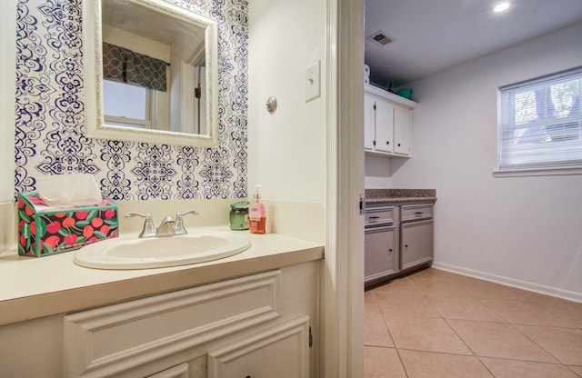 12103 Moorcreek Dr, Houston, TX 77070 - bathroom featuring vanity, tile patterned flooring, and baseboards