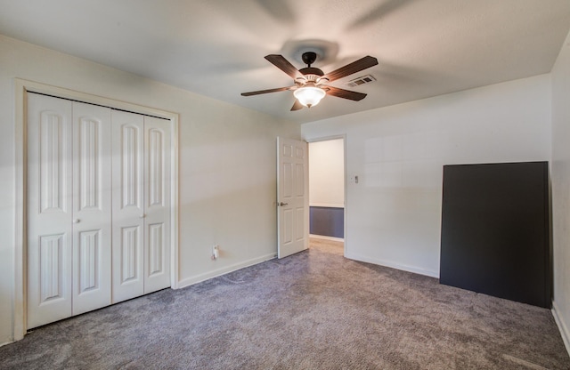 12103 Moorcreek Dr, Houston, TX 77070 - unfurnished bedroom featuring carpet floors, a closet, a ceiling fan, and baseboards