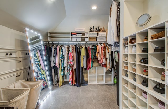 12103 Moorcreek Dr, Houston, TX 77070 - spacious closet with tile patterned floors and vaulted ceiling