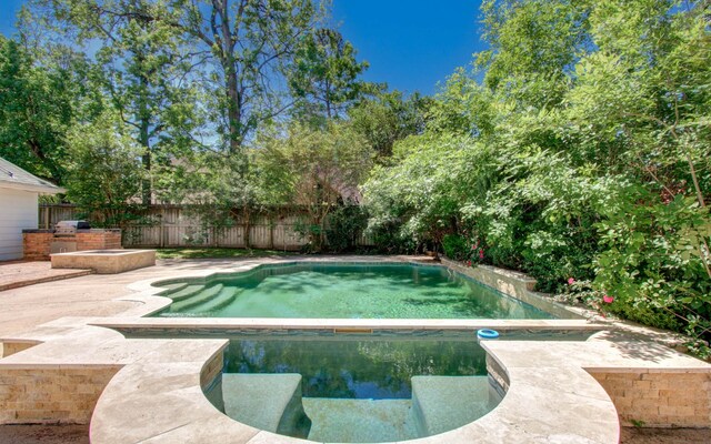 12103 Moorcreek Dr, Houston, TX 77070 - view of swimming pool featuring a fenced backyard, a patio, and a grill