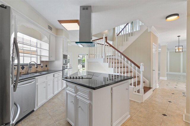 926 Montview Dr, Katy, TX 77450 - kitchen with a sink, appliances with stainless steel finishes, island exhaust hood, a kitchen island, and light tile patterned floors