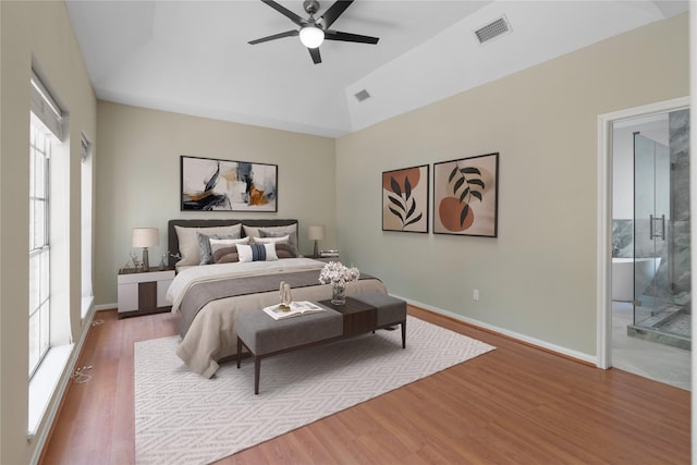 926 Montview Dr, Katy, TX 77450 - bedroom with wood finished floors, baseboards, ensuite bath, a ceiling fan, and lofted ceiling