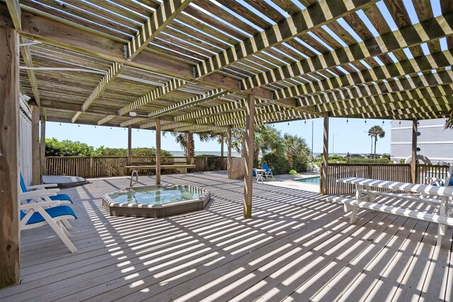 7600 Seawall Blvd Unit 109, Galveston, TX 77551 - view of patio featuring a pergola and a wooden deck