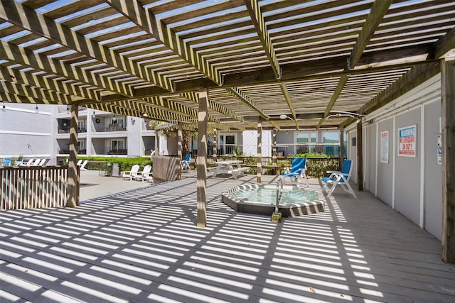7600 Seawall Blvd Unit 109, Galveston, TX 77551 - view of patio featuring a pergola