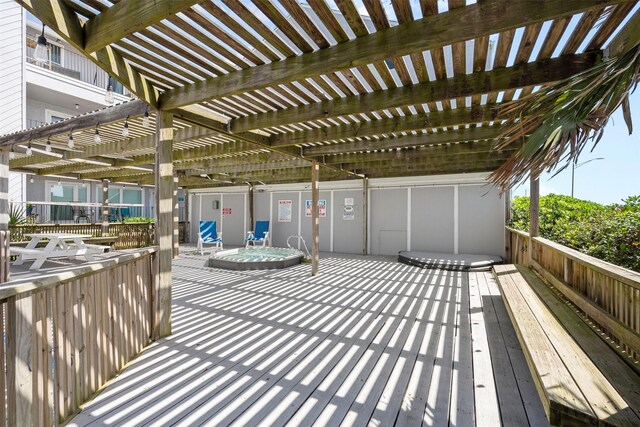 7600 Seawall Blvd Unit 109, Galveston, TX 77551 - wooden deck with a pergola