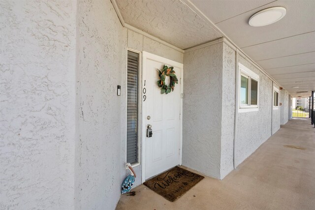 7600 Seawall Blvd Unit 109, Galveston, TX 77551 - entrance to property featuring stucco siding