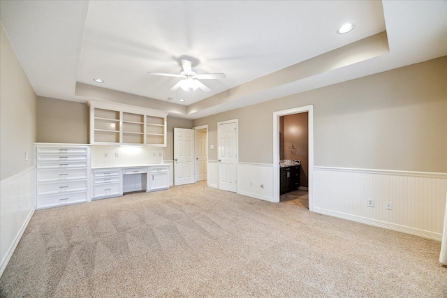 4911 Shiloh Lake Dr, Richmond, TX 77407 - unfurnished office featuring a ceiling fan, wainscoting, light carpet, a raised ceiling, and recessed lighting