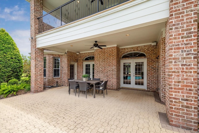 4911 Shiloh Lake Dr, Richmond, TX 77407 - view of patio / terrace featuring french doors, a balcony, ceiling fan, and outdoor dining space