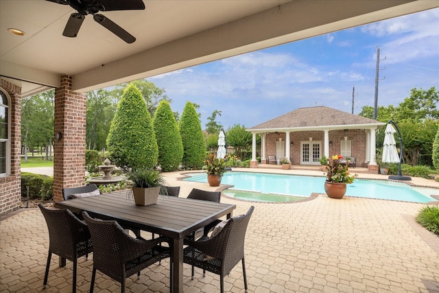 4911 Shiloh Lake Dr, Richmond, TX 77407 - view of patio featuring a storage structure, an outdoor structure, a pool with connected hot tub, french doors, and a ceiling fan