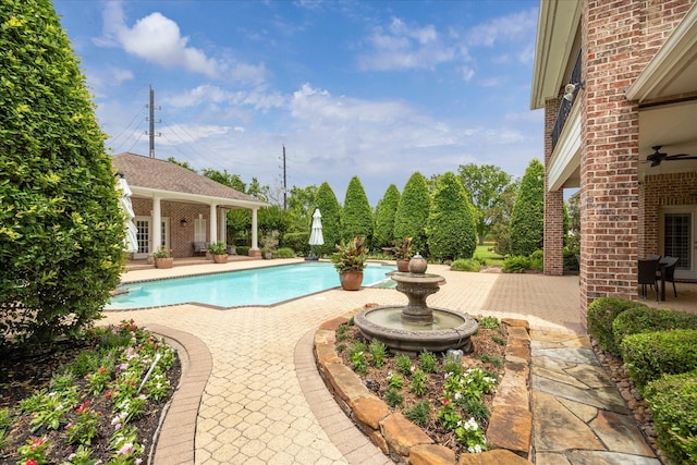 4911 Shiloh Lake Dr, Richmond, TX 77407 - outdoor pool featuring a patio, an outbuilding, a storage structure, and ceiling fan