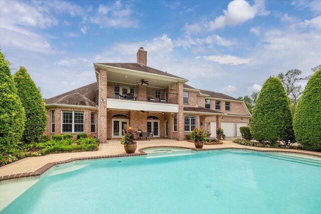 4911 Shiloh Lake Dr, Richmond, TX 77407 - rear view of house with french doors, brick siding, a chimney, ceiling fan, and a patio area