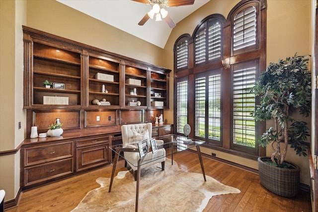 4911 Shiloh Lake Dr, Richmond, TX 77407 - living area with a ceiling fan, vaulted ceiling, light wood-style flooring, and baseboards