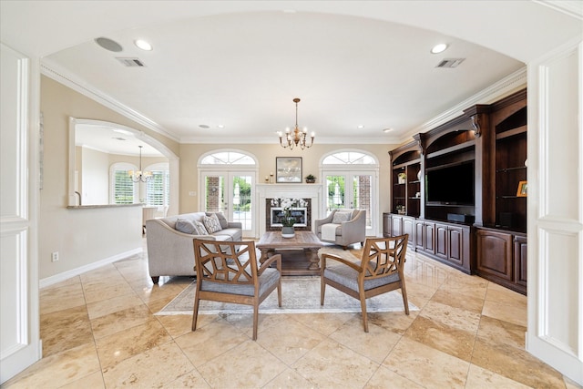 4911 Shiloh Lake Dr, Richmond, TX 77407 - living room with a chandelier, ornamental molding, baseboards, a glass covered fireplace, and recessed lighting