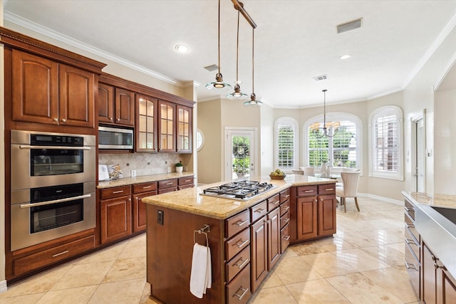 4911 Shiloh Lake Dr, Richmond, TX 77407 - kitchen featuring stainless steel appliances, crown molding, pendant lighting, tasteful backsplash, and glass insert cabinets