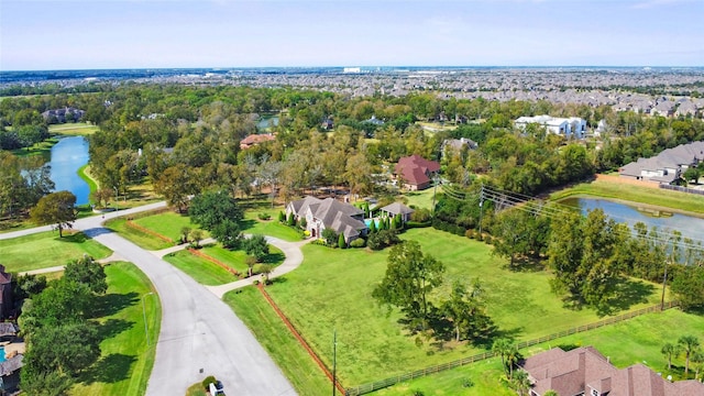 4911 Shiloh Lake Dr, Richmond, TX 77407 - aerial view of residential area featuring a large body of water and a tree filled landscape