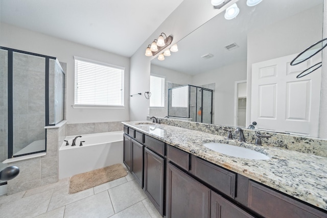 19918 Lizzie Ridge Ln, Cypress, TX 77433 - bathroom featuring a shower stall, double vanity, a bath, and tile patterned flooring