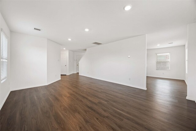 14611 Broadbury Pond Rd, Rosharon, TX 77583 - empty room featuring dark wood-type flooring, baseboards, and recessed lighting