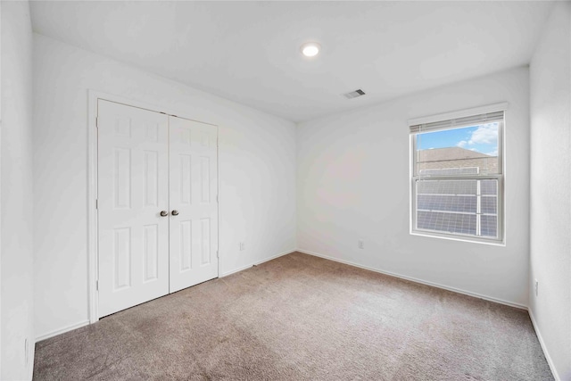 14611 Broadbury Pond Rd, Rosharon, TX 77583 - unfurnished bedroom featuring carpet flooring, a closet, and baseboards