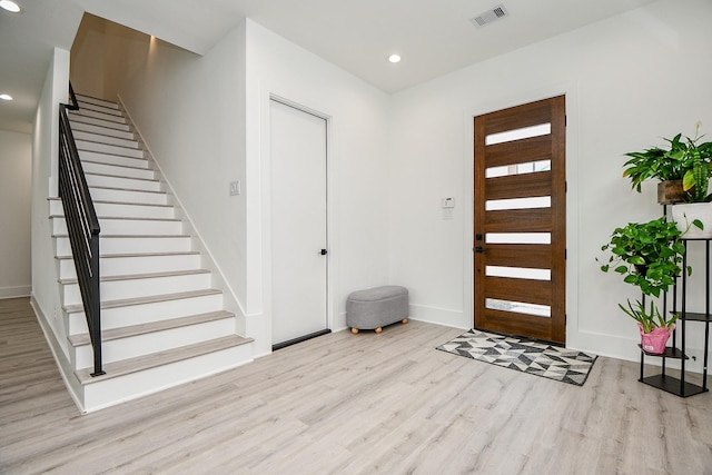 7603 Jacquelyn Gardens Ln, Houston, TX 77055 - entryway with wood finished floors, stairway, baseboards, and recessed lighting