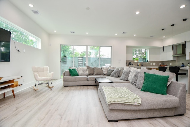 7603 Jacquelyn Gardens Ln, Houston, TX 77055 - living room with recessed lighting, light wood-style floors, and baseboards