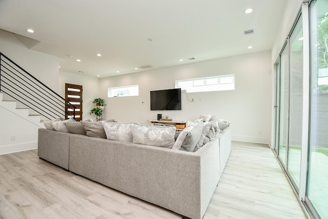 7603 Jacquelyn Gardens Ln, Houston, TX 77055 - living area featuring light wood-style flooring, stairway, recessed lighting, and baseboards