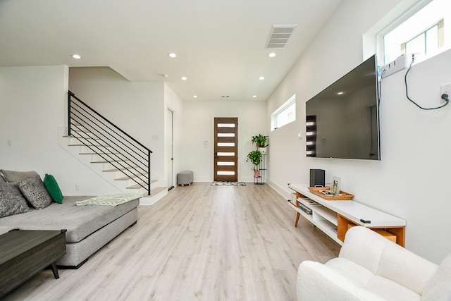 7603 Jacquelyn Gardens Ln, Houston, TX 77055 - living area featuring light wood-style flooring, recessed lighting, stairway, and baseboards