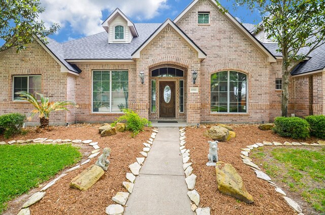 1511 Baldridge Ln, Katy, TX 77494 - view of front of home featuring brick siding and a shingled roof