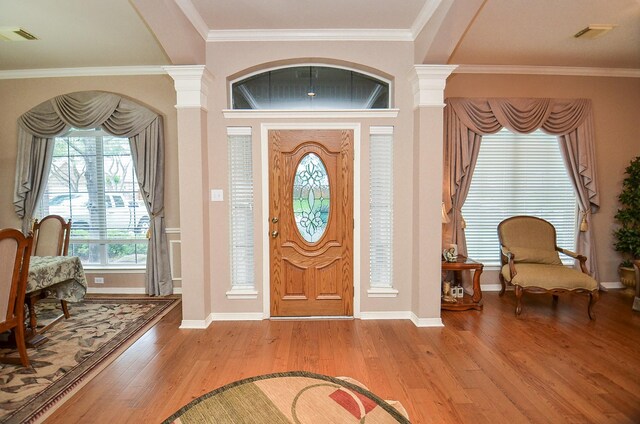 1511 Baldridge Ln, Katy, TX 77494 - foyer featuring wood finished floors, decorative columns, ornamental molding, and baseboards