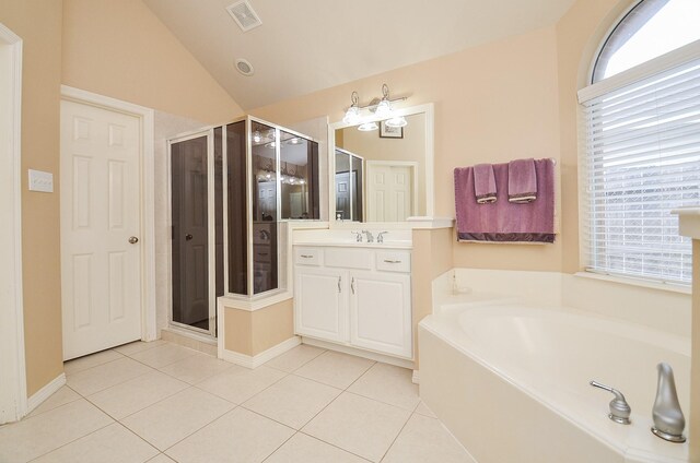 1511 Baldridge Ln, Katy, TX 77494 - bathroom featuring a bath, vanity, tile patterned flooring, a shower stall, and lofted ceiling