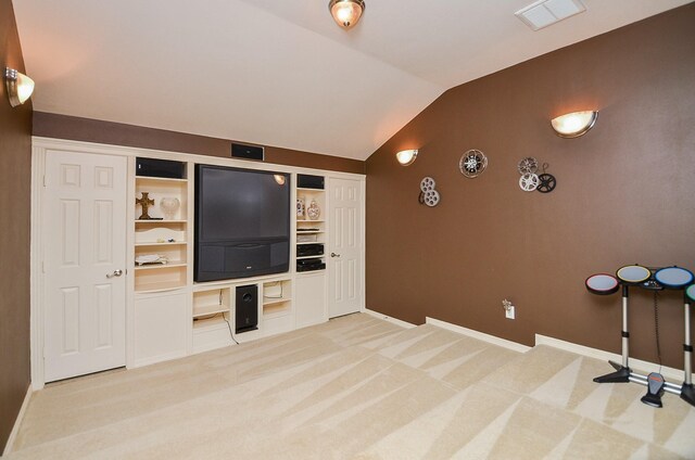 1511 Baldridge Ln, Katy, TX 77494 - cinema room featuring lofted ceiling, light carpet, and baseboards